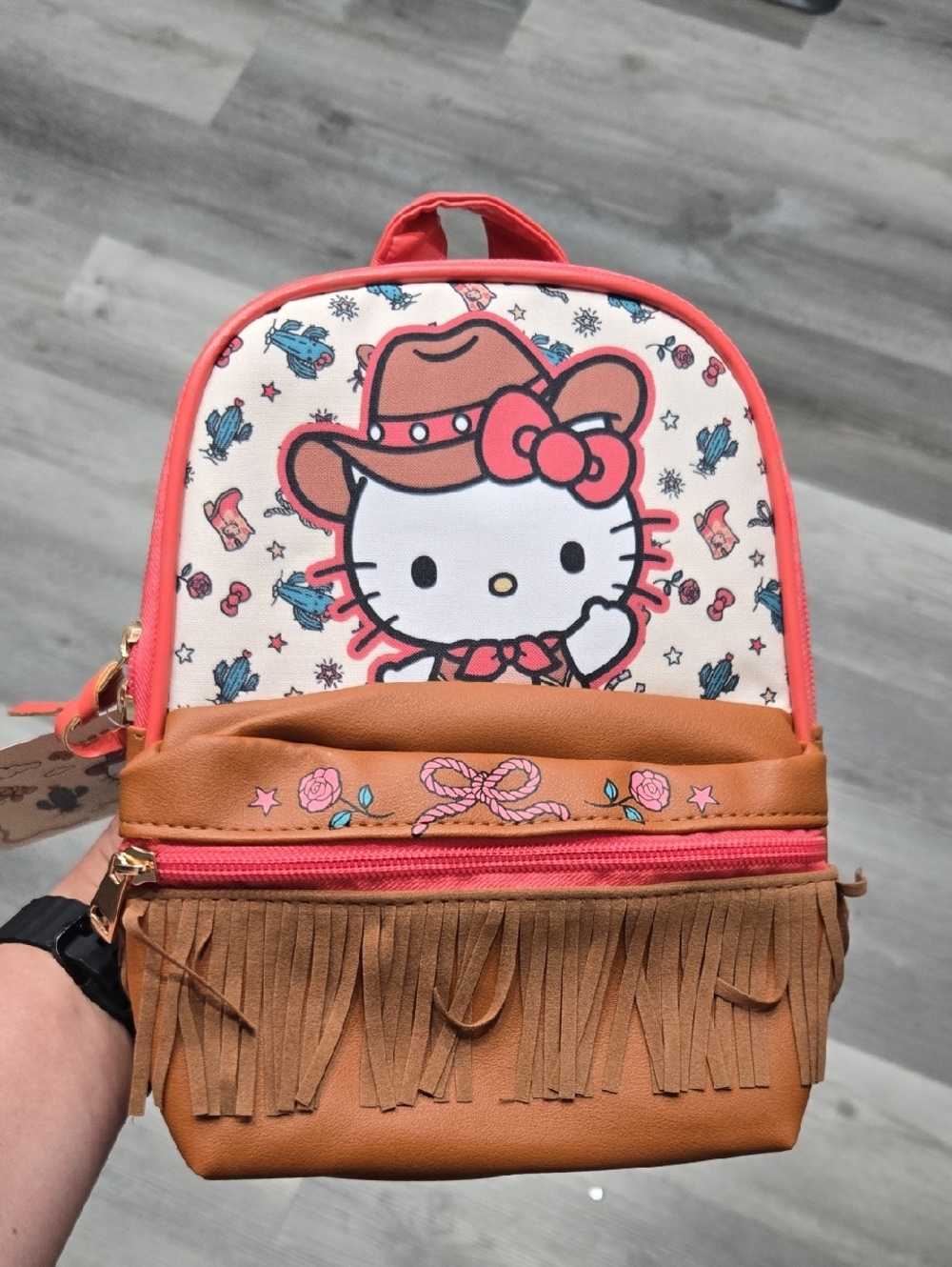 Sanrio Hello Kitty cowgirl-themed mini backpack featuring faux leather
